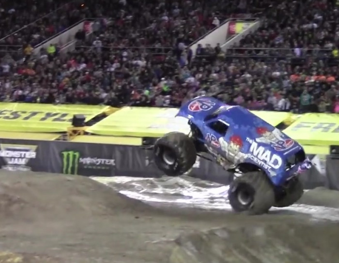 Monster truck lands a front flip.