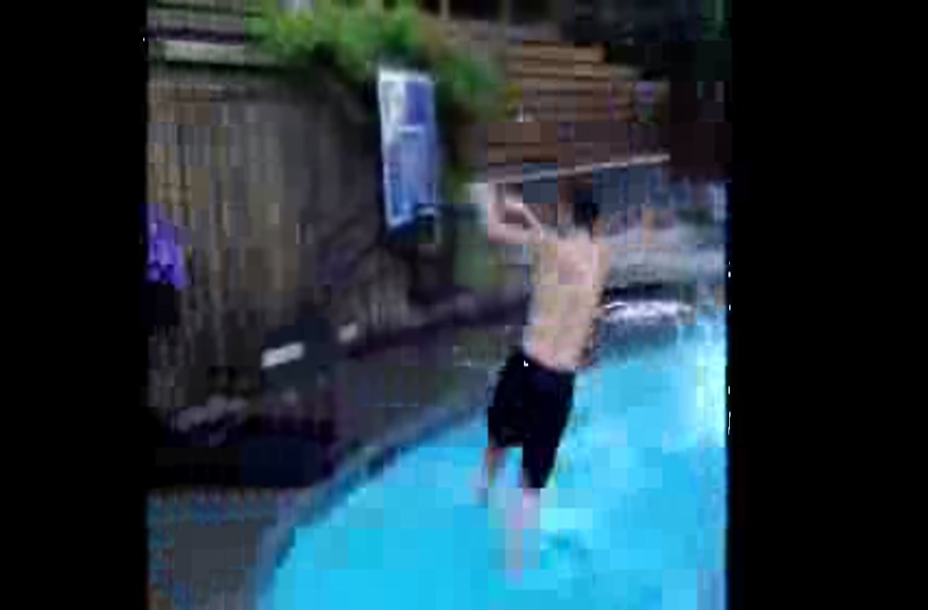 Watch These Eight Men Perform A Swimming Pool Basketball Dunk