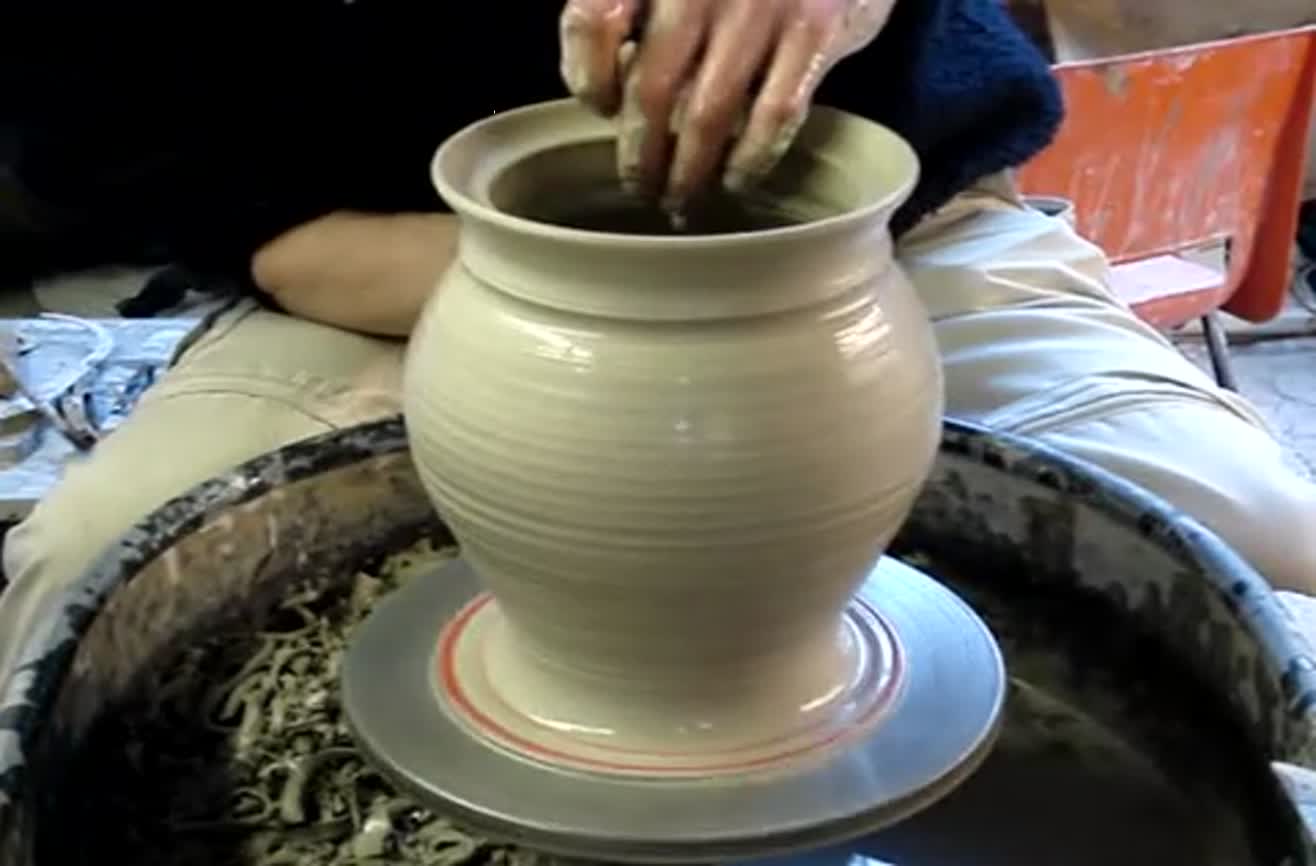 Making Clay Pottery With A Potter's Wheel.