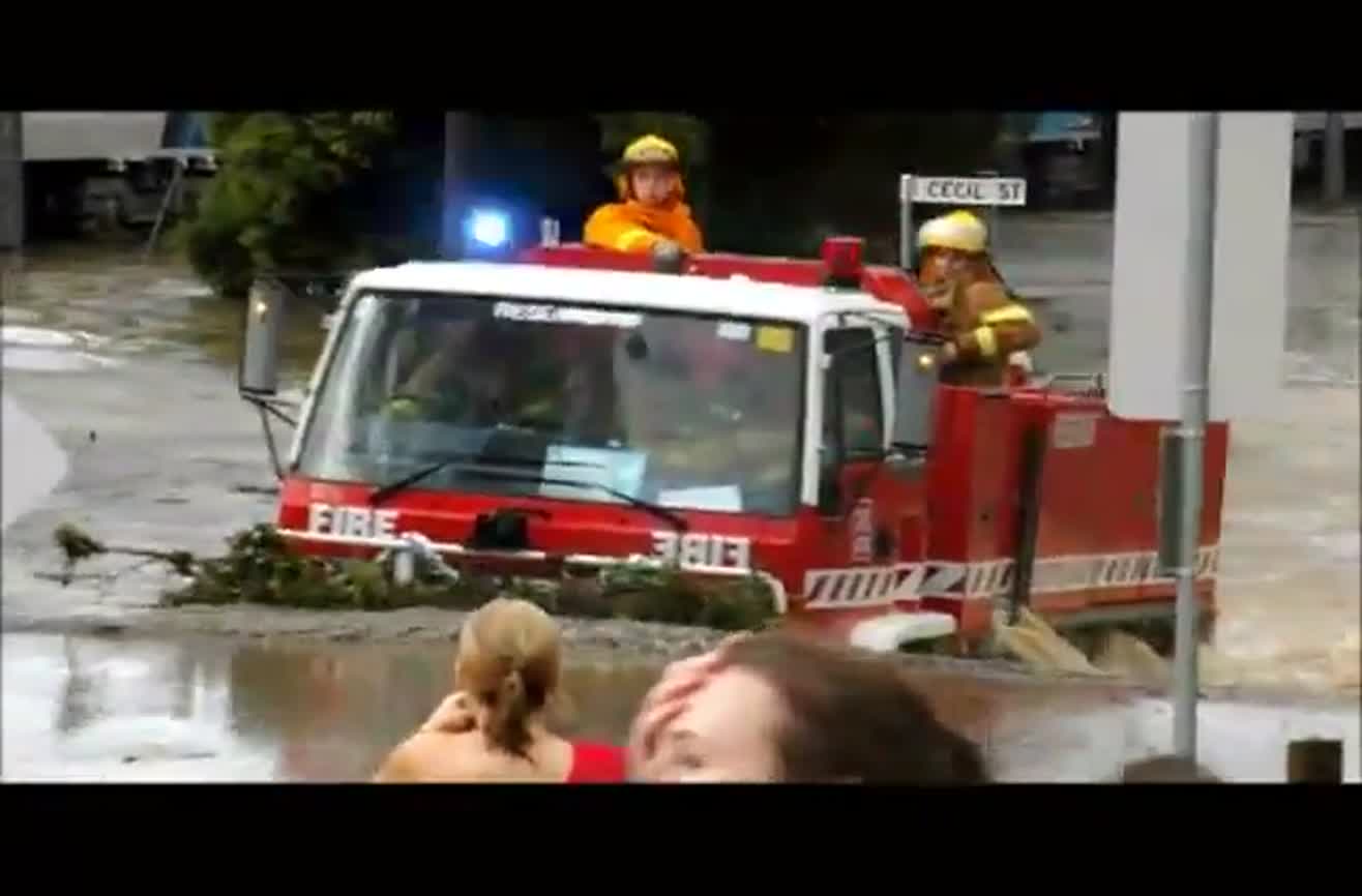 Fire truck drives through an 11-foot flood.