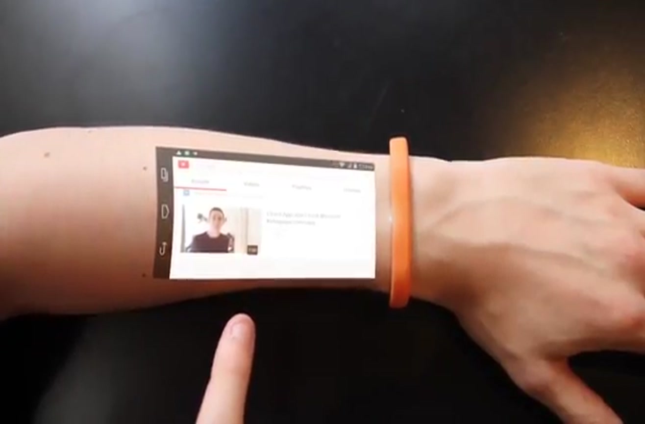 Futuristic wristband converts skin into a touch screen.