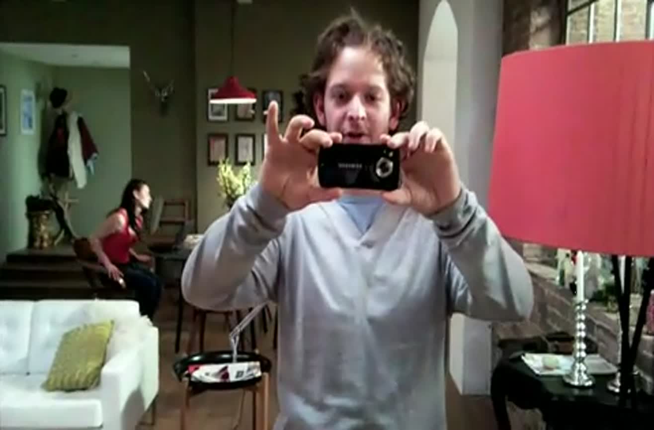 Man performs camera trick.